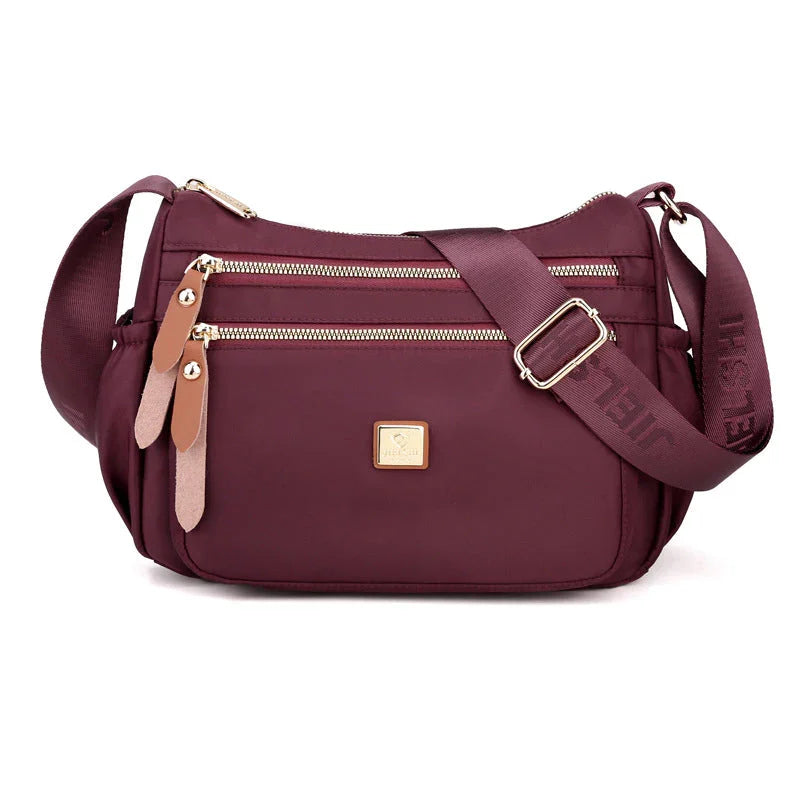 Shoulder strap bag with multiple compartments