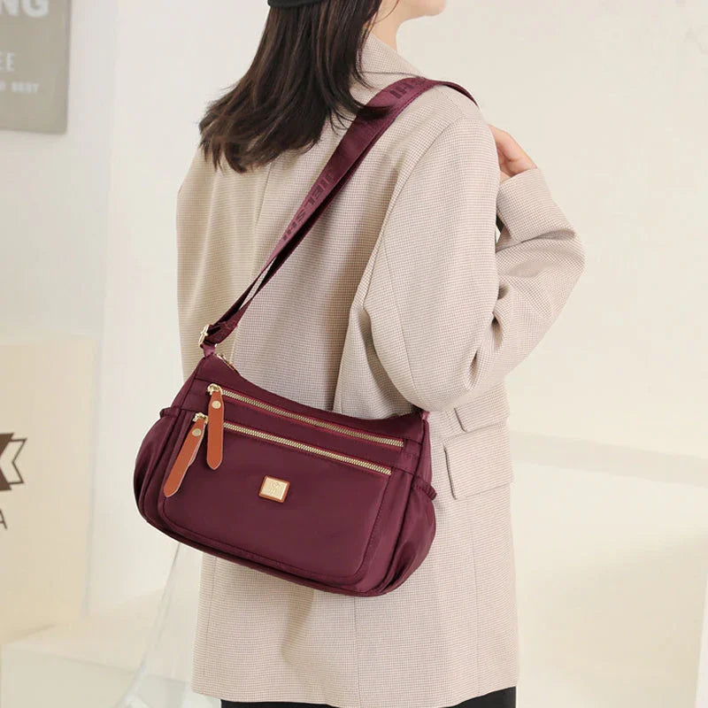 Shoulder strap bag with multiple compartments