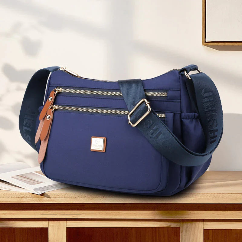 Shoulder strap bag with multiple compartments