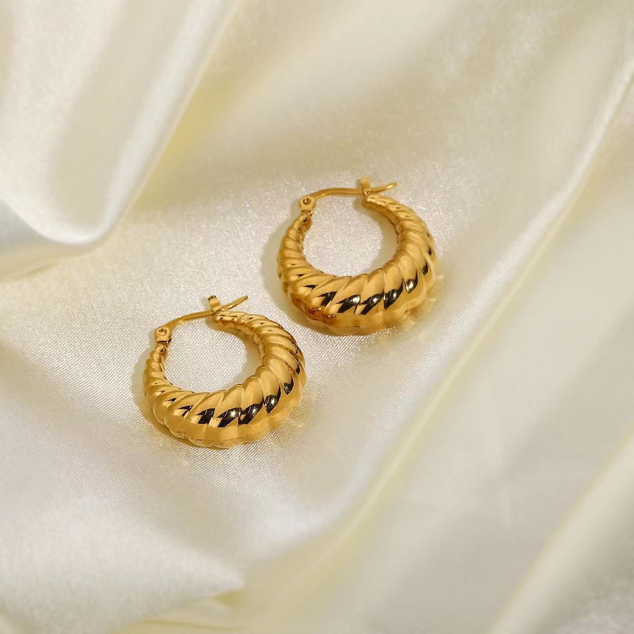 Gold Twisted Croissant Hoop Earrings