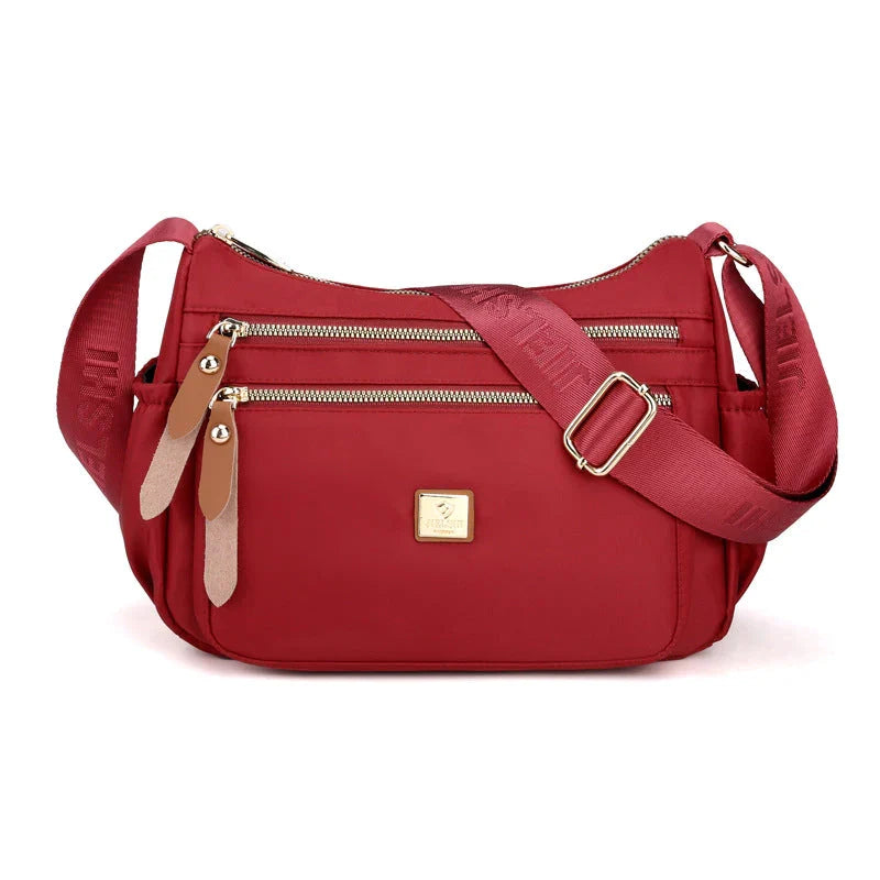 Shoulder strap bag with multiple compartments