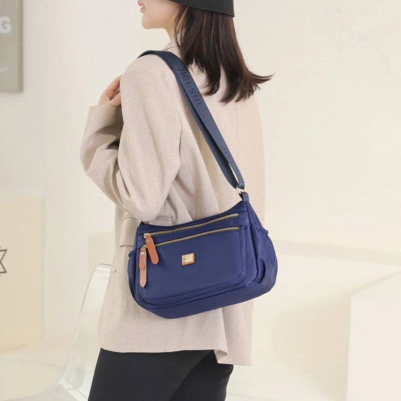 Shoulder strap bag with multiple compartments