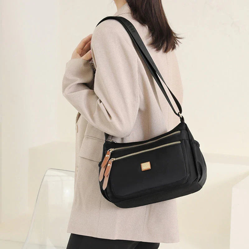 Shoulder strap bag with multiple compartments